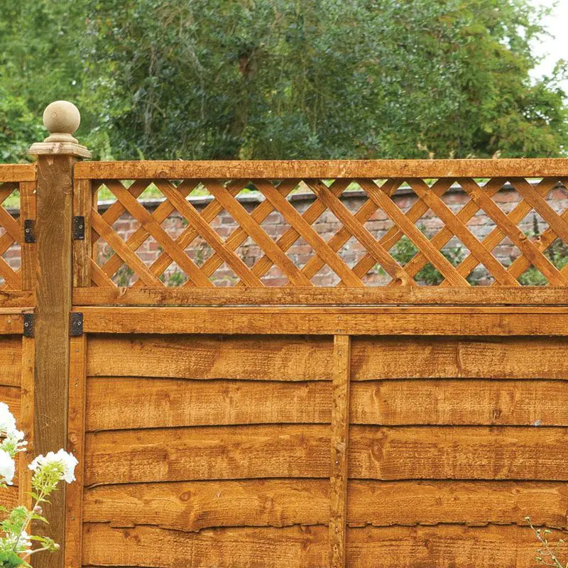 a lattice fence topper, like the one in this photo, can help give privacy without making the garden feel smaller: one of our small garden fencing ideas