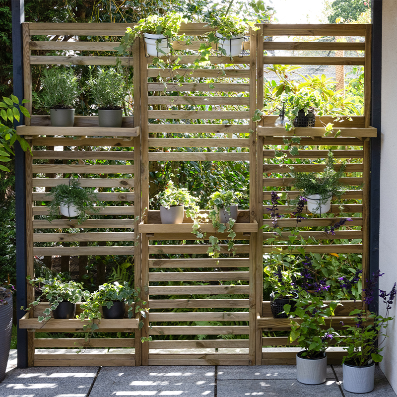 these slatted tall wall planters are ideal trellis for vertical gardening
