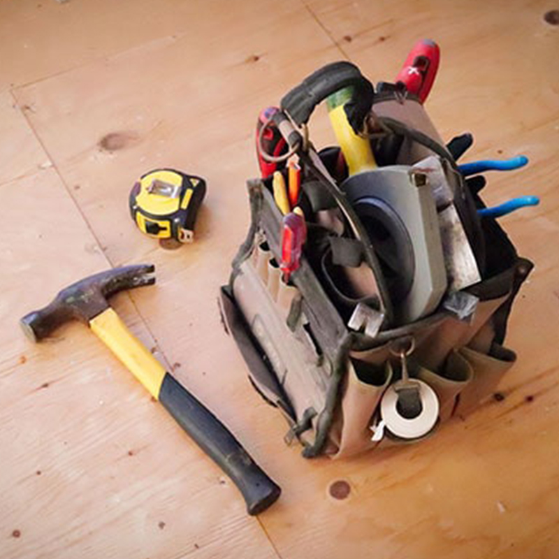 a bag of tools used for garden gate installation