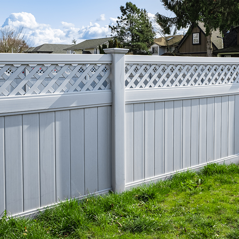 a white fence is one of our small garden fencing ideas