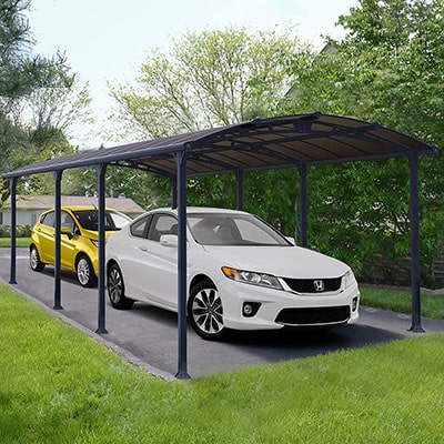 a white car and a yellow car underneath a grey metal double carport