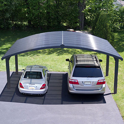 2 cars underneath an arched metal double carport