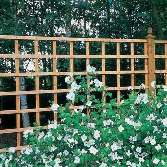a 1 foot tall wooden trellis that would be perfect to attach to a wooden fence